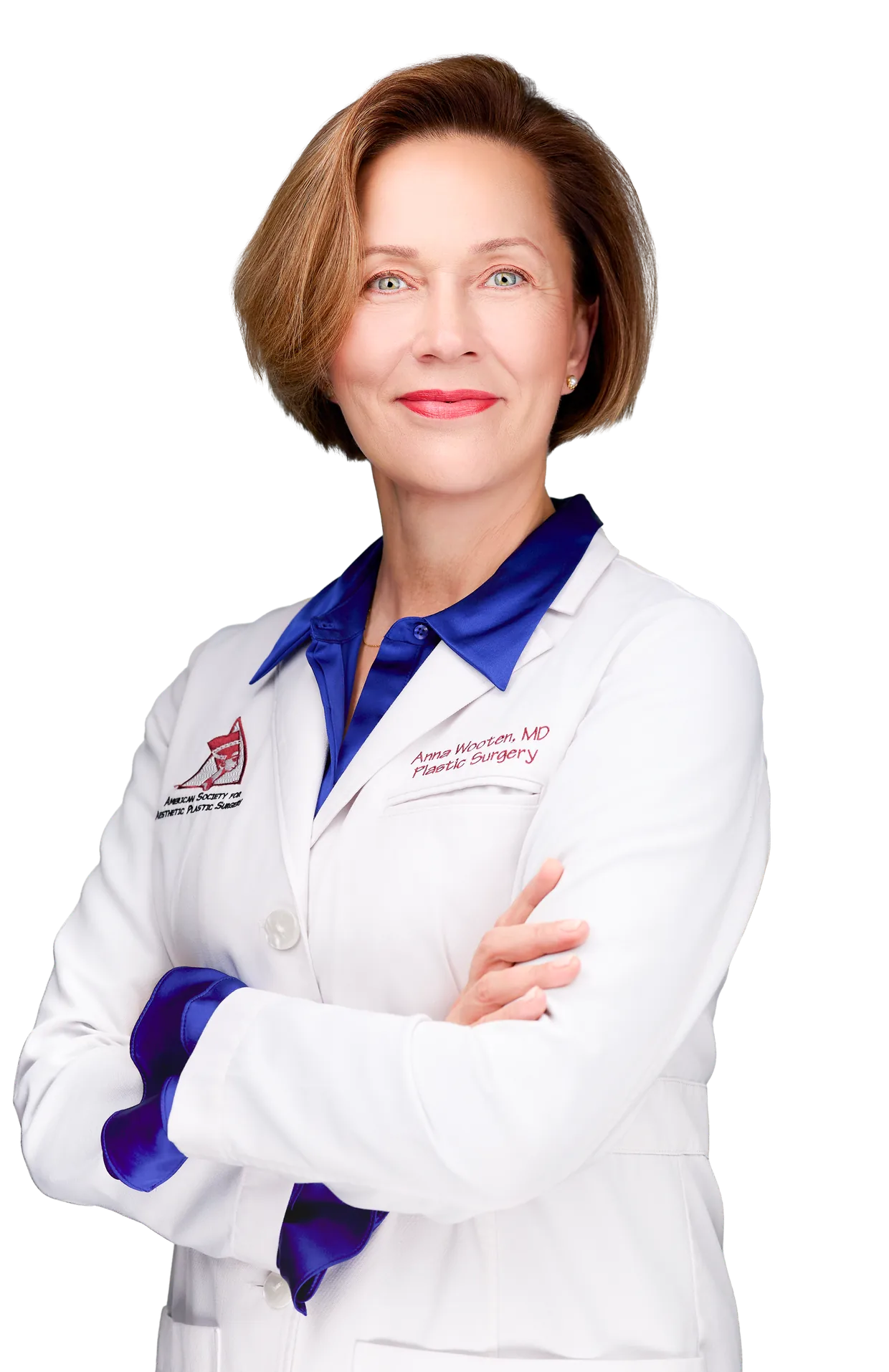 Dr. Anna Wooten, plastic surgeon, in a white coat with her arms crossed