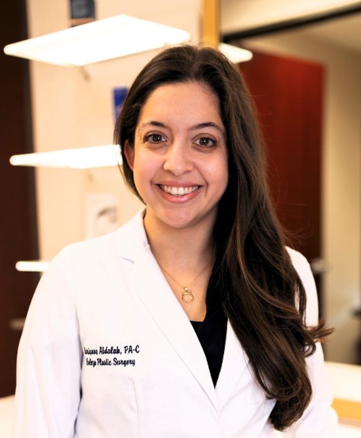 Marianne N. Abdalah, surgical physician assistant, smiling in a white coat